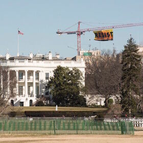 Activists climb crane near The White House to deliver not-so-subtle message to the masses