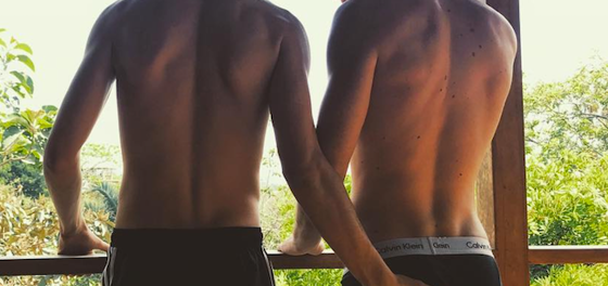 Boybander gives fans an eye-full while on vacation with model boyfriend
