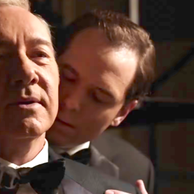Who’s this man nuzzling Kevin Spacey’s neck?