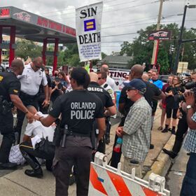WATCH: Antigay protestor arrested at Pulse memorial… and the crowd goes wild!