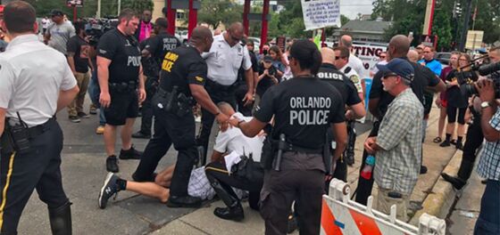 WATCH: Antigay protestor arrested at Pulse memorial… and the crowd goes wild!