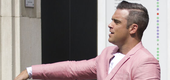 Robbie Williams gamely strips down to promote his upcoming album