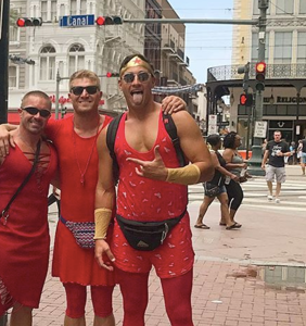 PHOTOS: Thousands of musclebound men put on skimpy red dresses and ran through New Orleans