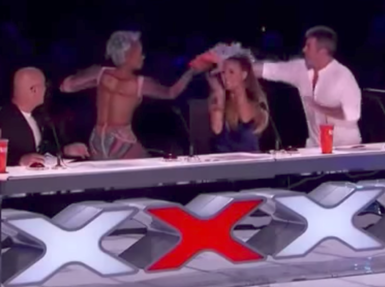 Mel B throws her drink on Simon Cowell. He totally deserved it.