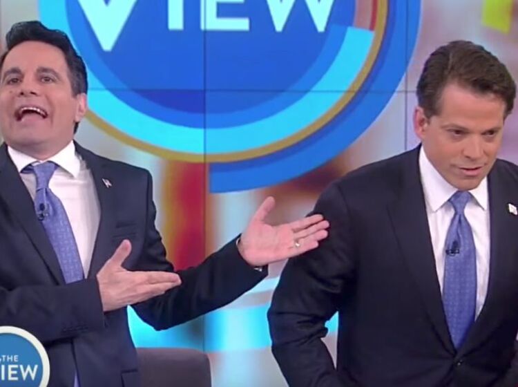 Trump’s ousted staffer doesn’t look thrilled as he’s mocked by gay comic on “The View”