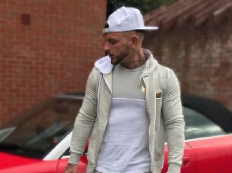 Reality TV’s Sean Pratt poses with slick ride, but nobody’s looking at the car
