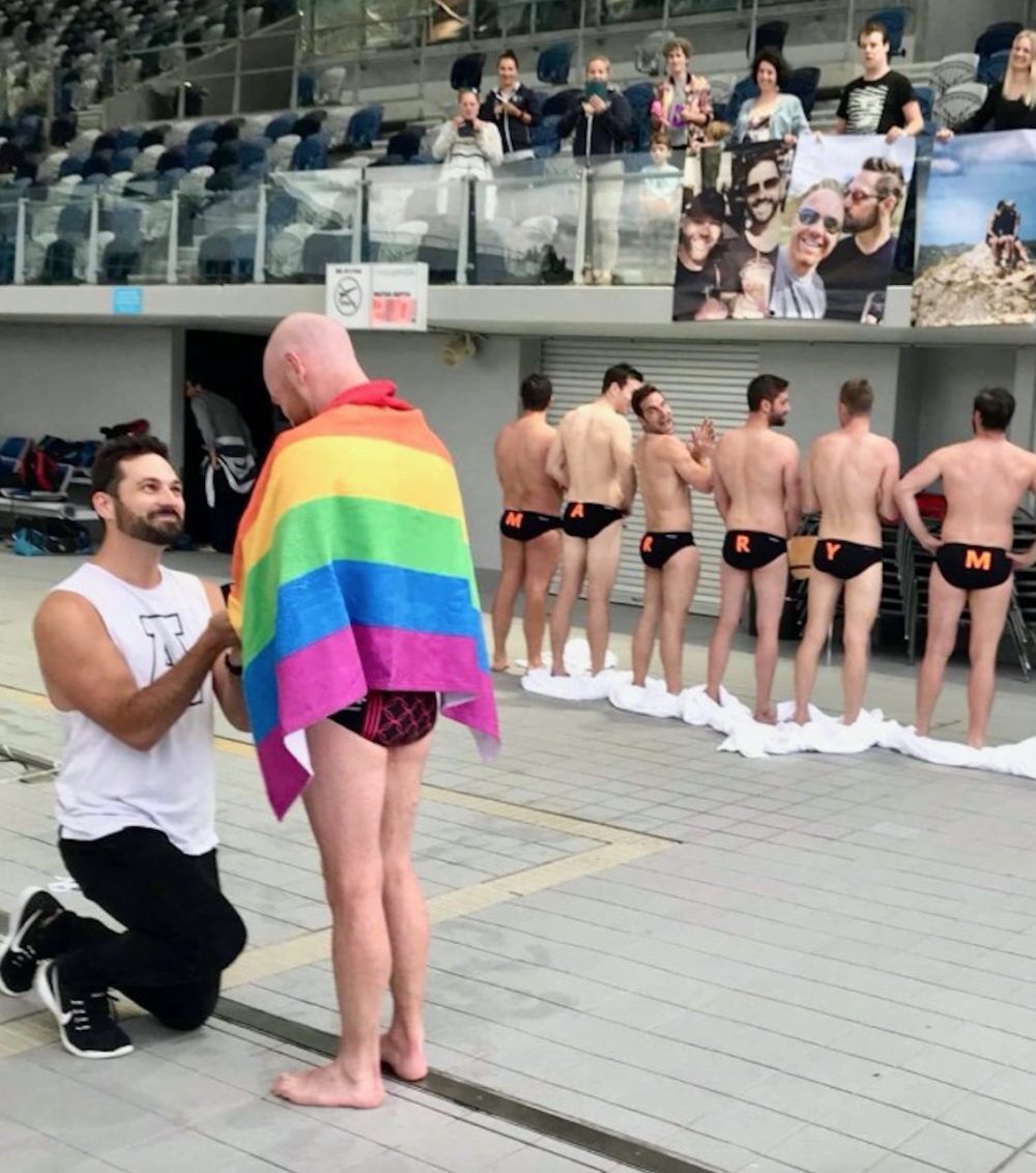 Man proposes to boyfriend at water polo match — with help from some Speedo-clad hotties