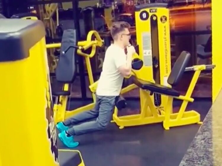 Um, what is that man doing to that weight machine?
