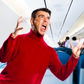 Passengers look on in disgust as living embodiment of toxic masculinity tries to exit plane
