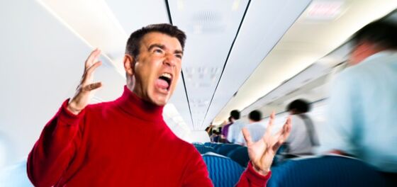 Passengers look on in disgust as living embodiment of toxic masculinity tries to exit plane