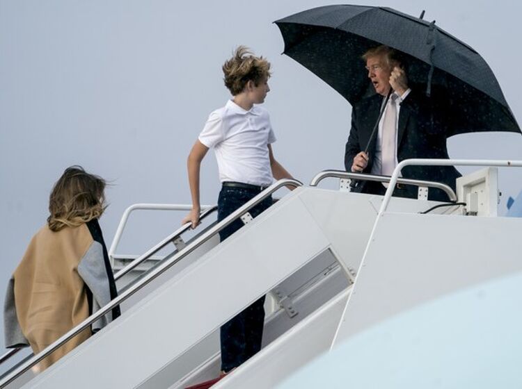 Donald Trump hogs umbrella, leaves family exposed to elements on wet, frigid tarmac