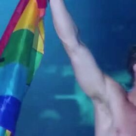 Which shirtless Mormon superstar just waved a Pride flag for a massive crowd?