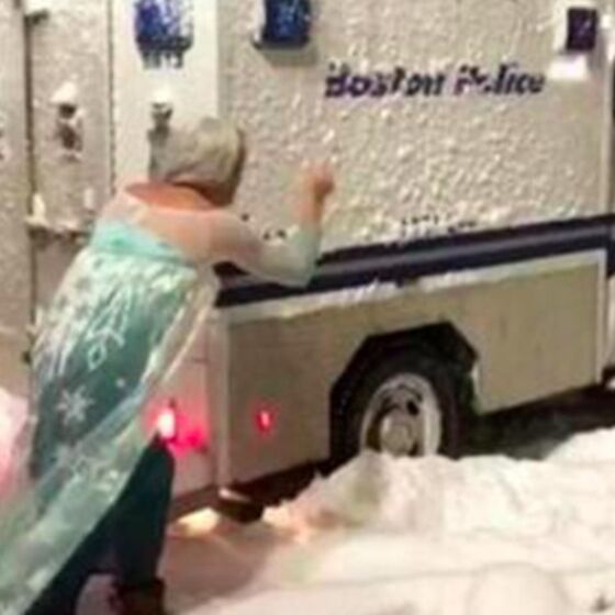 Watch this drag queen dressed as Elsa single-handedly free a police van that’s stuck in the snow