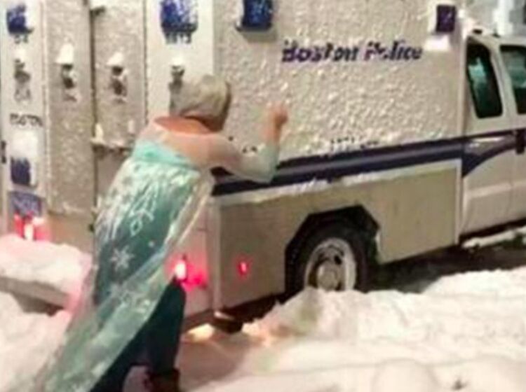 Watch this drag queen dressed as Elsa single-handedly free a police van that’s stuck in the snow