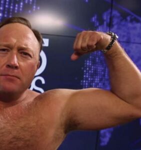 Alex Jones busted on air for watching x-rated video starring trans woman