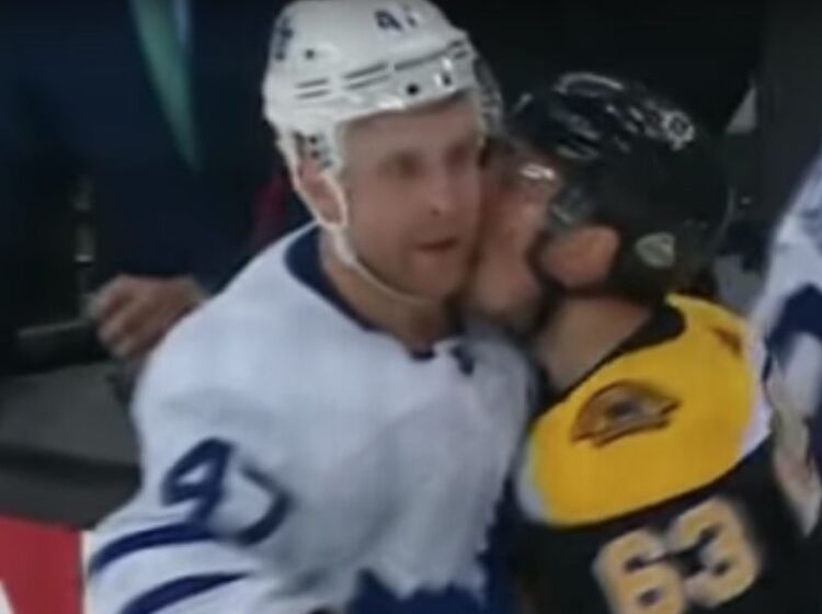 WATCH: NHL player goes in for a wet one on opponent mid-game