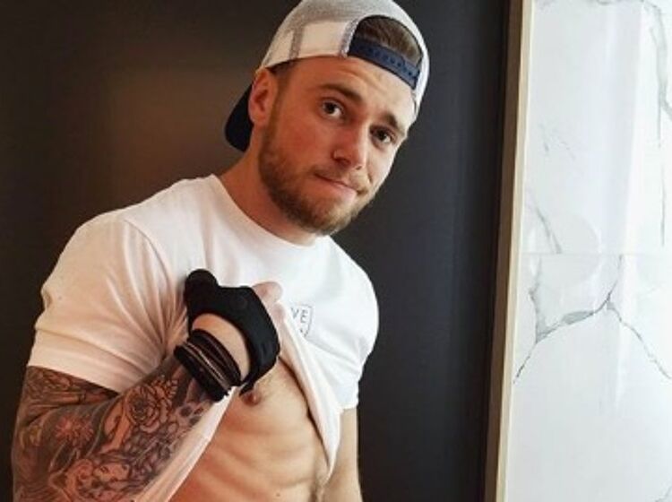 Gus Kenworthy strips for a dip