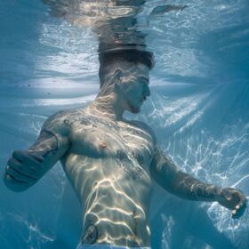 Stripping down for underwater photographer just in time for Toronto Pride
