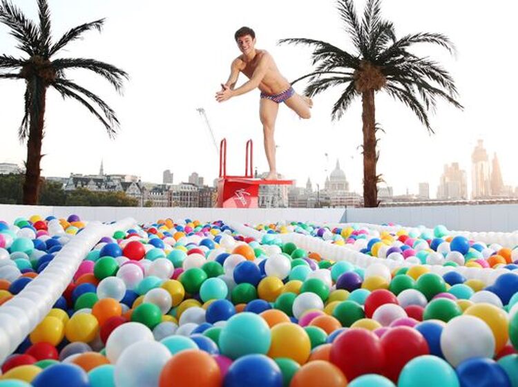 The world is Tom Daley’s playground as he dives into a pool of balls