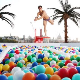 The world is Tom Daley’s playground as he dives into a pool of balls