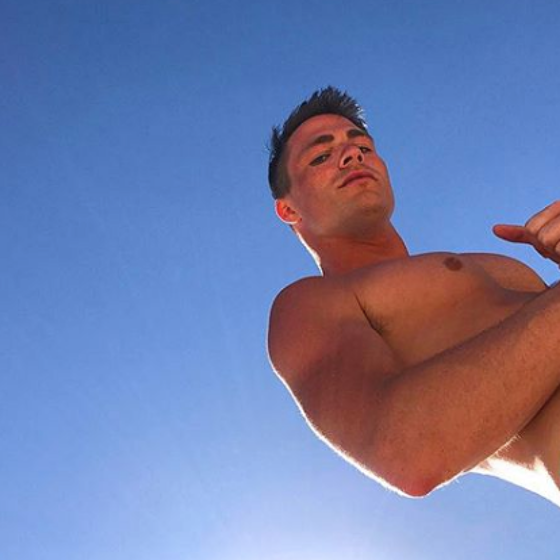 Colton Haynes nearly loses his swim trunks while swinging from a vine like Tarzan