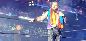 Gay pro-wrestler kicks a$$ in championship match wearing rainbow flag and a harness