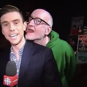 Gay reporter files police report after having ear licked by slobbering comedian on live TV