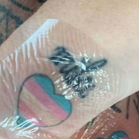 Parents surprise trans son with matching trans flag tattoos