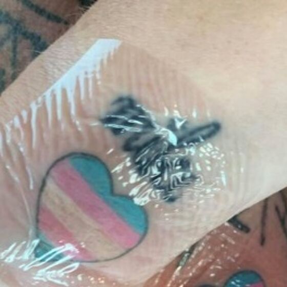 Parents surprise trans son with matching trans flag tattoos