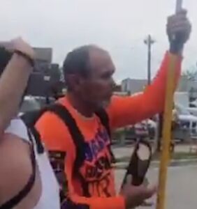 WATCH: 2 guys drive away a Christian Pride protestor by passionately making out