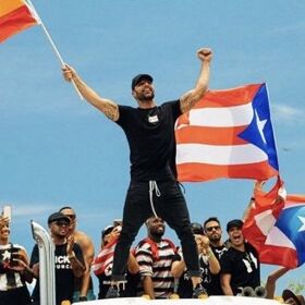Ricky Martin marches with pride flag against embattled Puerto Rican governor