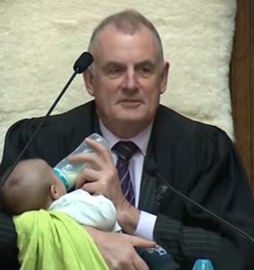 Photo of politician babysitting for gay colleague goes viral for all the right reasons