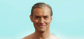 Jude Law and his tiny speedo turn heads on the beach