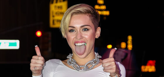 Barely a month after their divorce, Miley Cyrus is already living with their new girlfriend