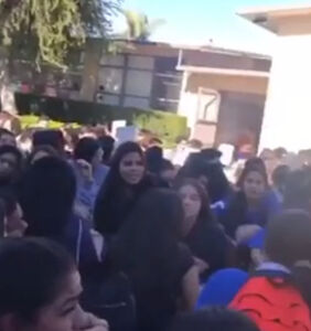 200 high school students stage walkout in support of queer classmate