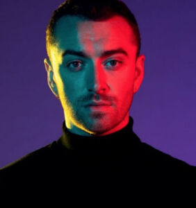 Um, who's this super hot guy Sam Smith was just photographed making out with at a bar?
