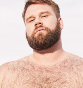 Gay plus-size model Michael McCauley apologizes for racist posts, but not everyone is happy with it