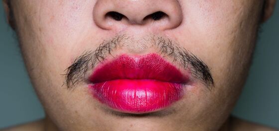 University employee says he was fired for wearing lipstick to work
