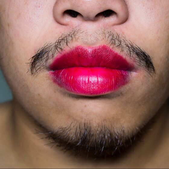 University employee says he was fired for wearing lipstick to work