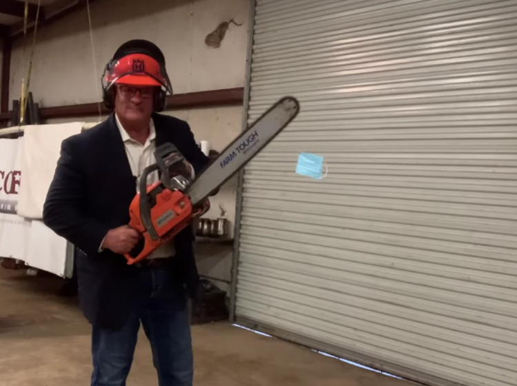 Antigay lawmaker compares himself to "Jews in Nazi Germany" as he chainsaws a mask in half