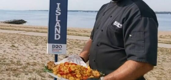 Everyone’s talking about the beefcake chef holding a tray of fried calamari during the DNC roll call