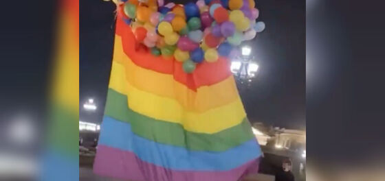 Gay artist uses balloons to float giant rainbow flag over Moscow