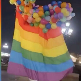 Gay artist uses balloons to float giant rainbow flag over Moscow