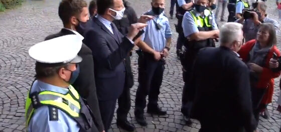 WATCH: Out-gay Health Minister cuts speech short after crowd yells “gay pig!”