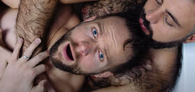 Tom Goss lathers up with a hairy hunk in his latest music video