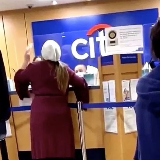 Karen, in her bathrobe, has meltdown inside bank, refuses to wear mask, claims to be a scientist