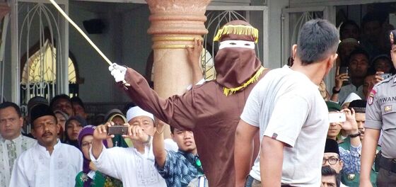 Two men in Indonesia brace for public caning after getting caught having gay sex