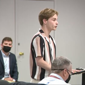 Gay high schooler suspended for nail polish tears into local school board at public hearing