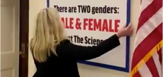 Marjorie Taylor Greene puts up anti-trans sign on Congress corridor wall