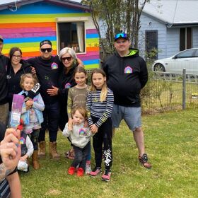 Neighbors help gay man paint his home in rainbows after he gets homophobic abuse